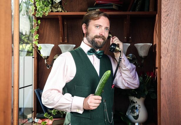 man holding cucumber